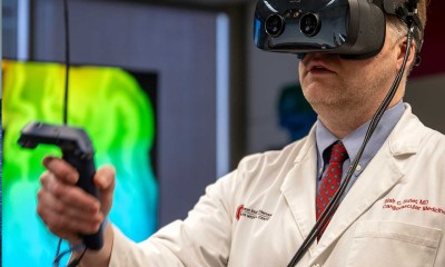 OSU cardiologist Blair Suter, MD, is peering at a 3D image of a patient’s heart using a virtual reality software called syGlass