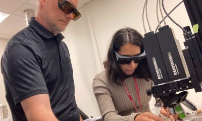 UC doctoral student Manisha Sheokand, right, works with Procter and Gamble Scientist Tim Reichling, a UC biology alumnus. Photo/Michael Miller